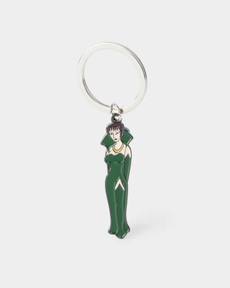 Custom-shaped metal keychain featuring a vampire girl in a green dress.