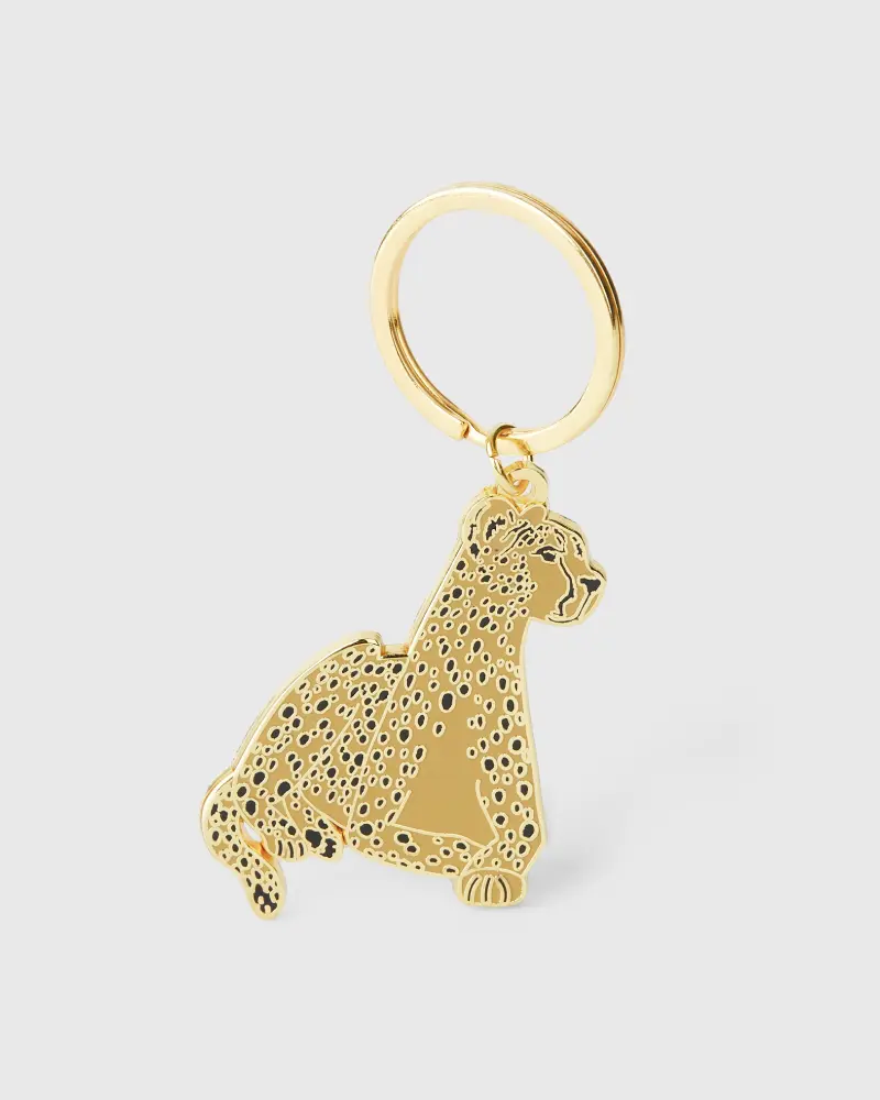 Gold metal keychain showcasing a cheetah.