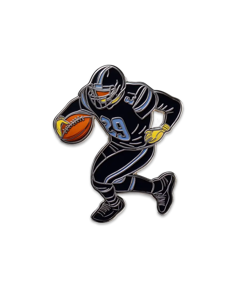 Enamel pin depicting a football player in black and blue uniform holding a football.