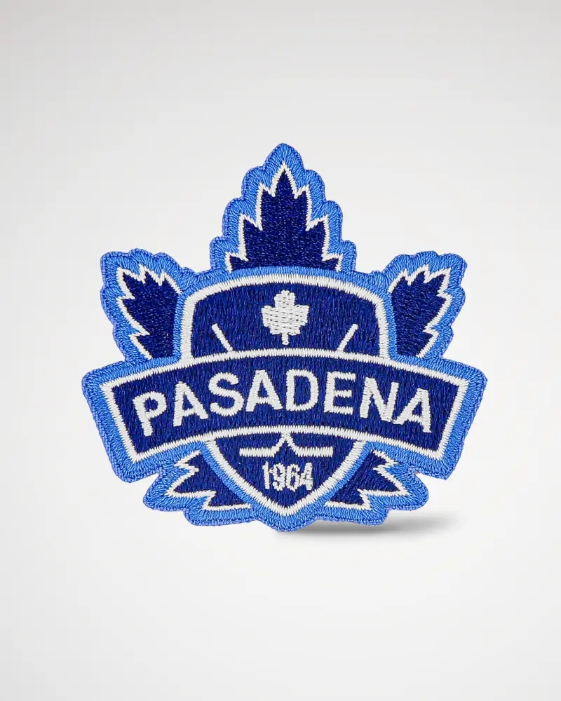 Woven patch with a custom maple leaf shape in blue and white, displaying “Pasadena 1964.”