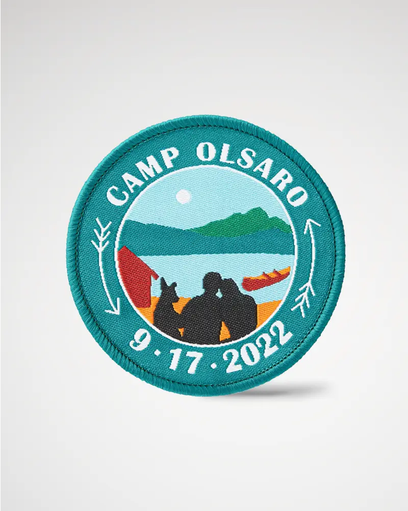 Round woven patch with a lakeside camping scene, labeled ‘Camp Olsaro 9-17-2022.’