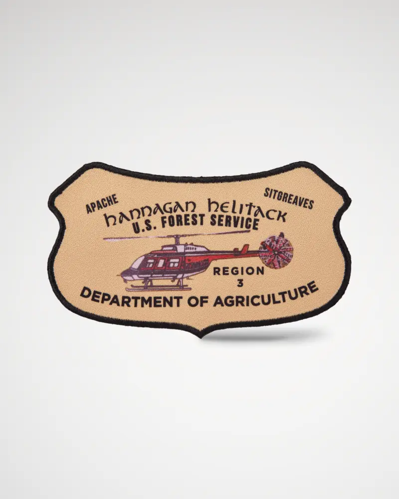 Custom shield-shaped printed patch in vintage style with a helicopter and “Department of Agriculture.”