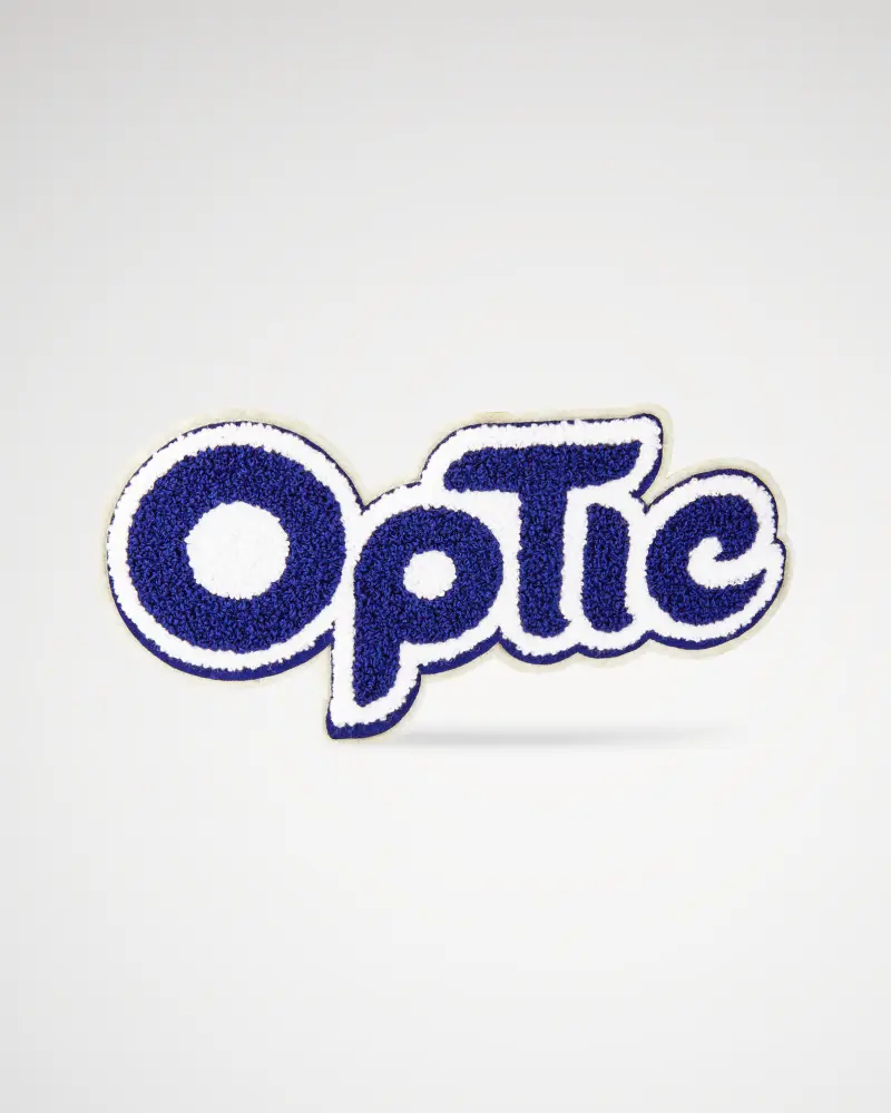 Soft chenille patch in blue with white border featuring the word “Optic.”