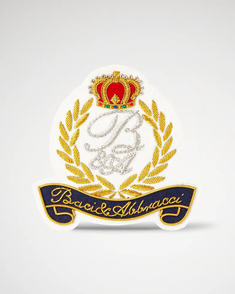 Luxurious custom bullion patch with white background, silver and gold metal bullion, featuring a crown and “B&A” text.