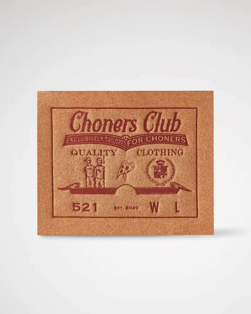 Real brown leather patch with vintage-style “Chores Club” text.