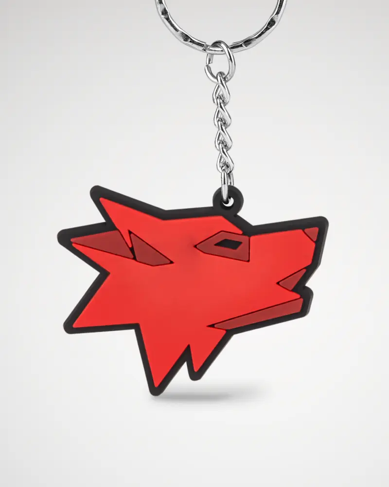 PVC keychain in the shape of a modern, stylized red dog.