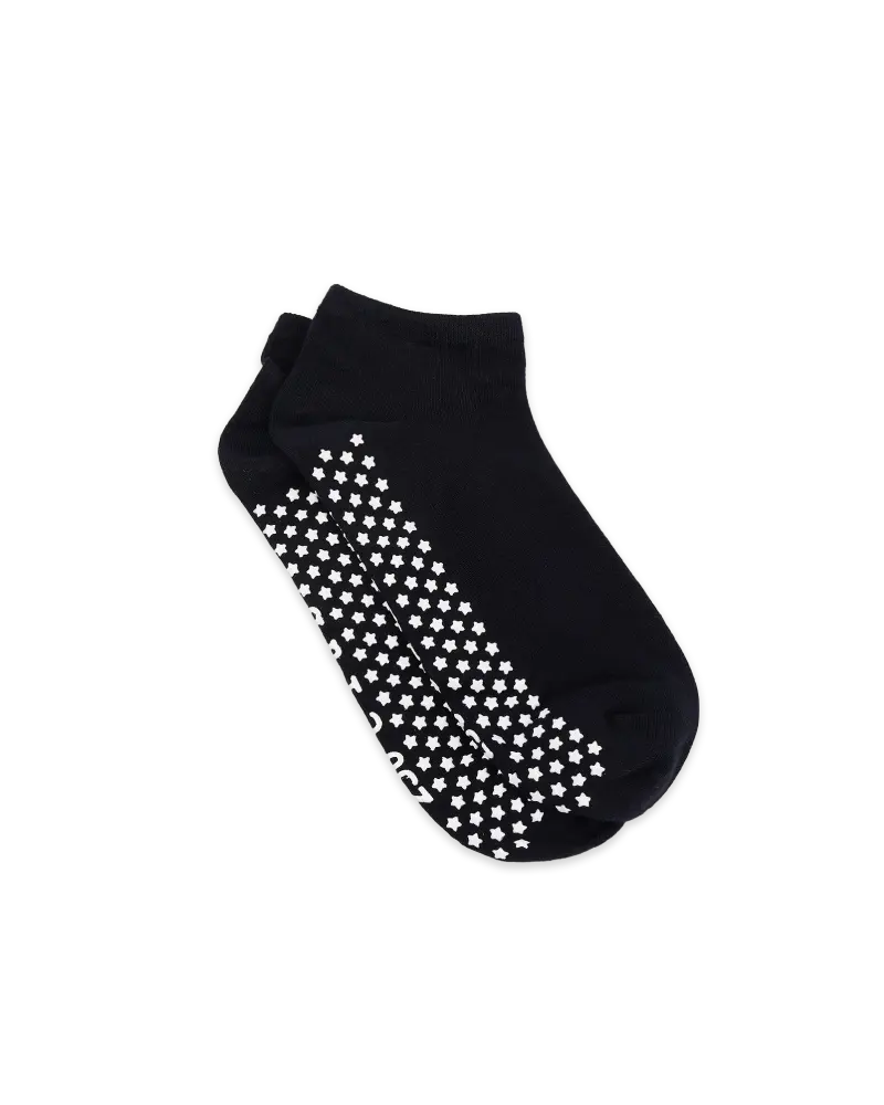 Black socks with white star and moon patterns on the soles