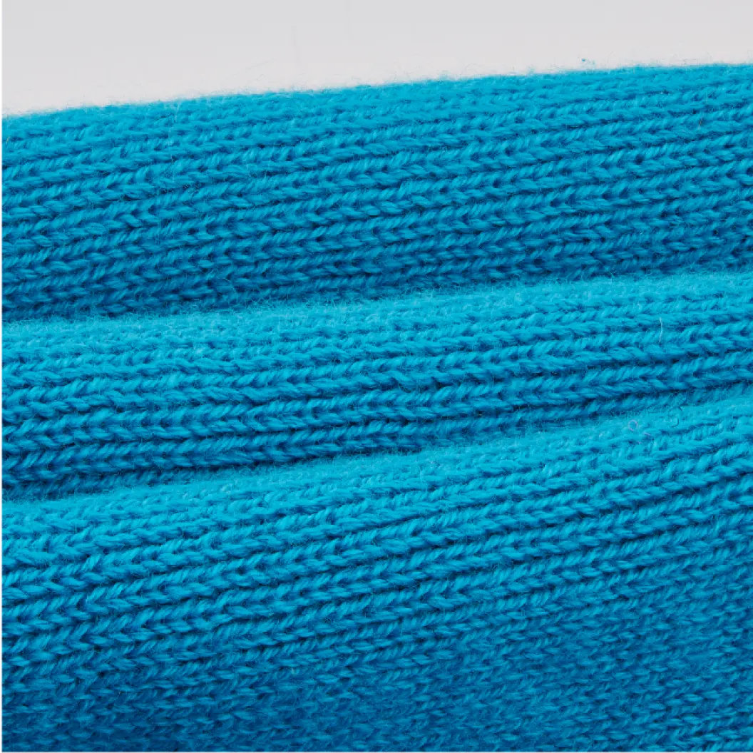 Close-up of a blue knitted fabric.