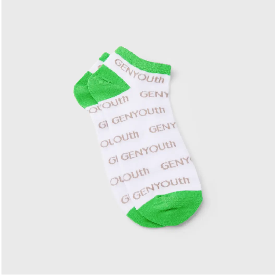 White ankle socks with green details and repeating “GENYouth” text