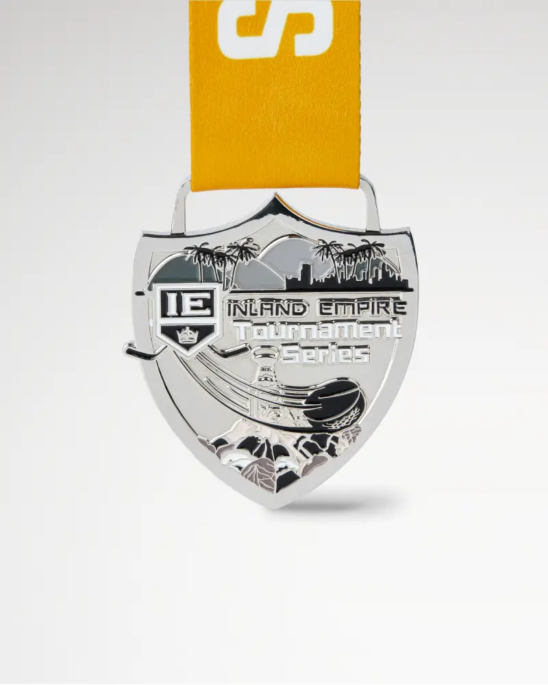 Silver shield medal with “Inland Empire Tournament Series” text and palm tree design.