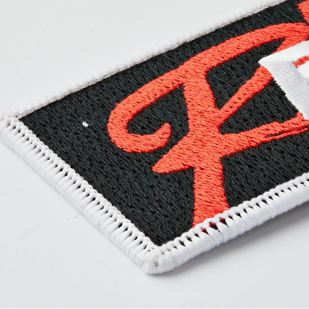 Border style for embroidered keychain, featuring stitching techniques to enhance design and durability.