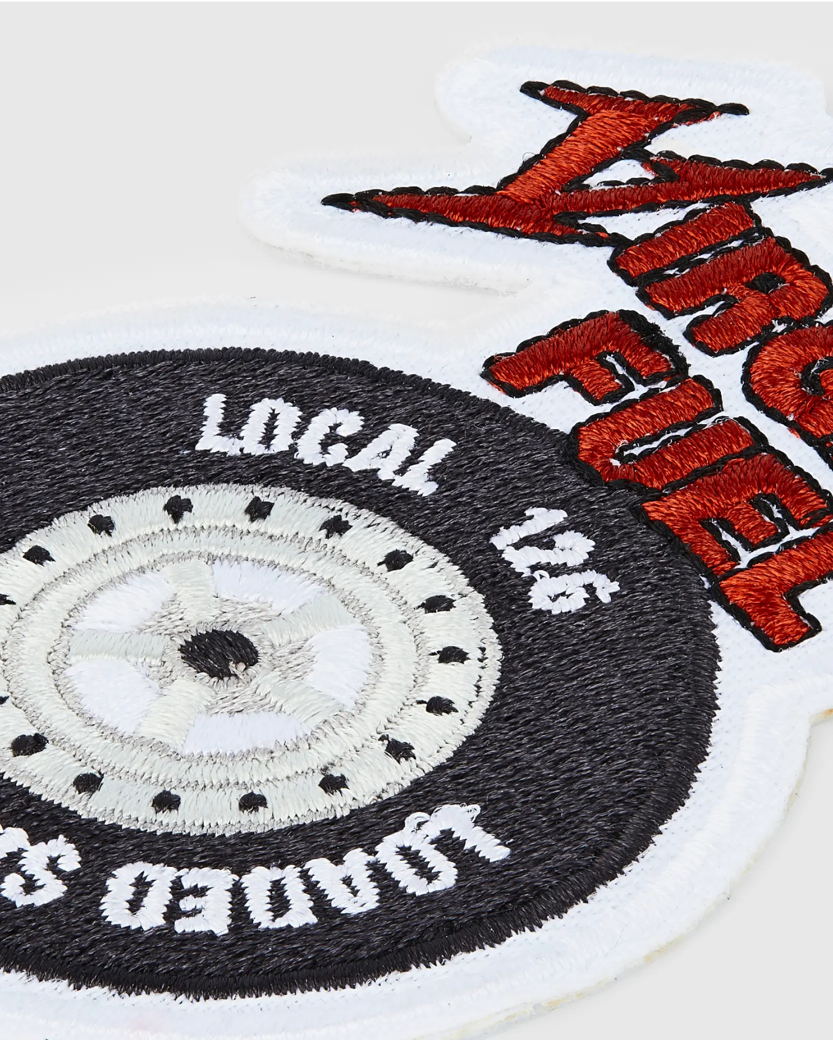 Custom embroidered patch featuring tire design and bold red text “Nitro Fuel.”