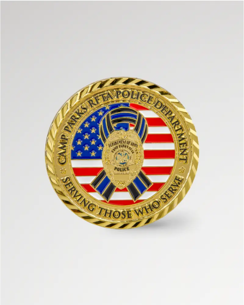 Gold and enamel coin with a U.S. flag and police badge, labeled ‘Camp Parks Police Department