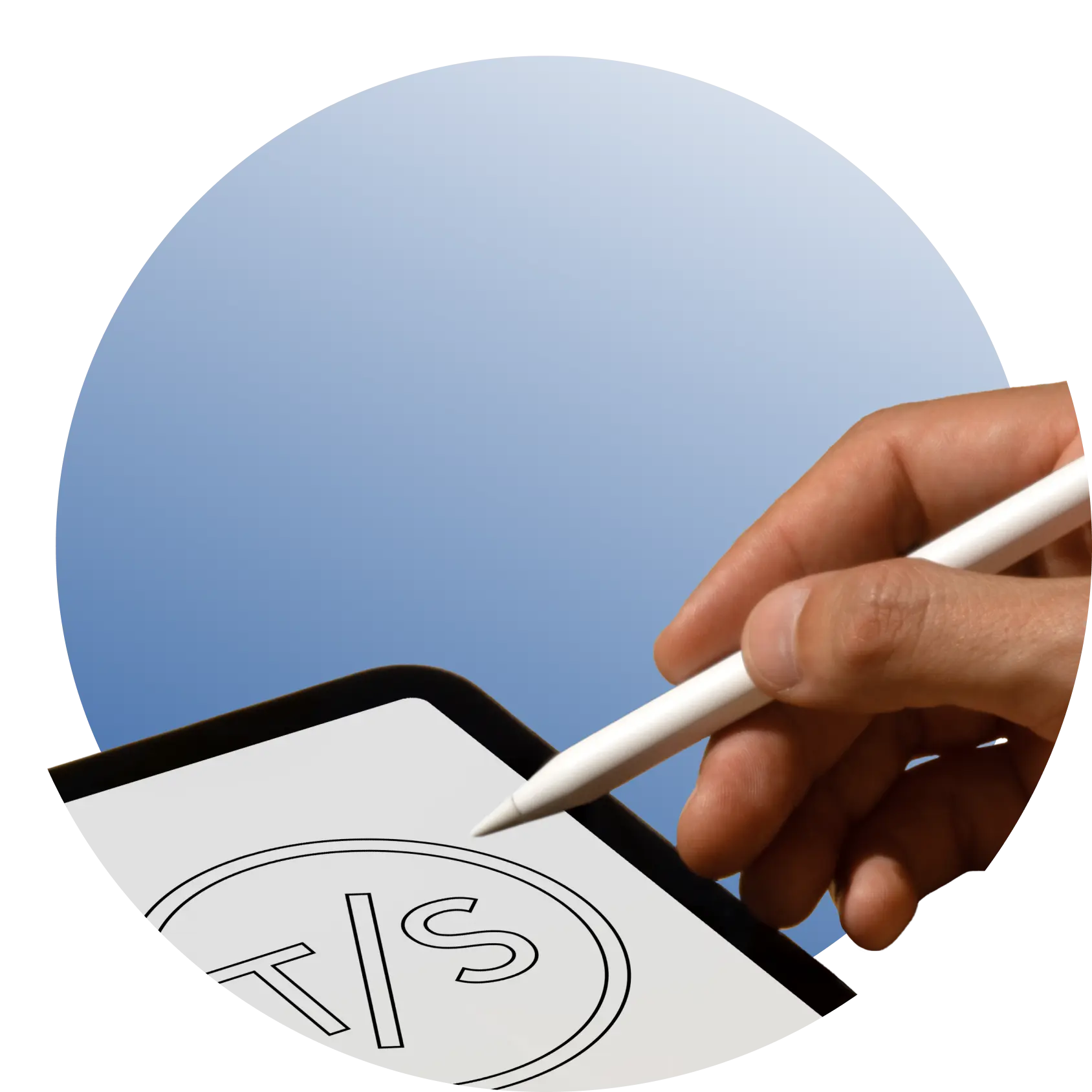 Hand using a stylus to design THE/STUDIO logo on a tablet screen.