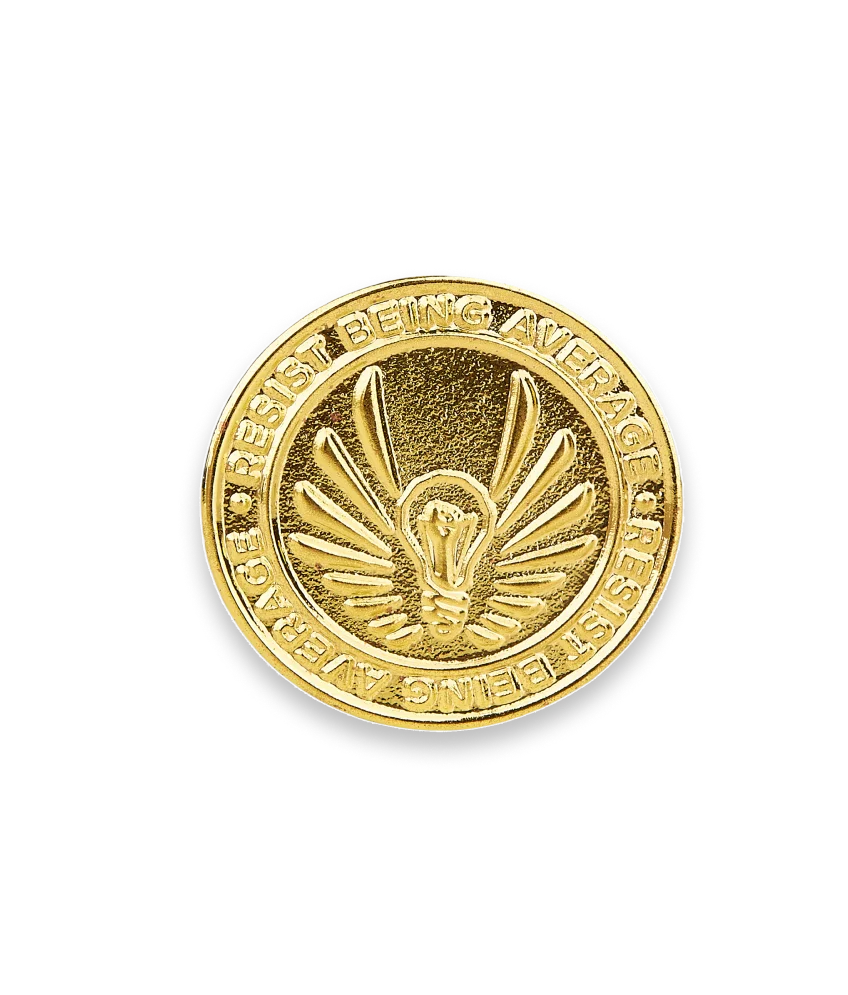 Military gold metal pin featuring a polished finish and intricate detailing, symbolizing honor.