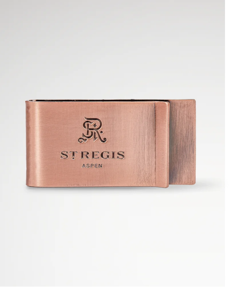 Rose gold money clip engraved with the “St. Regis Aspen” logo