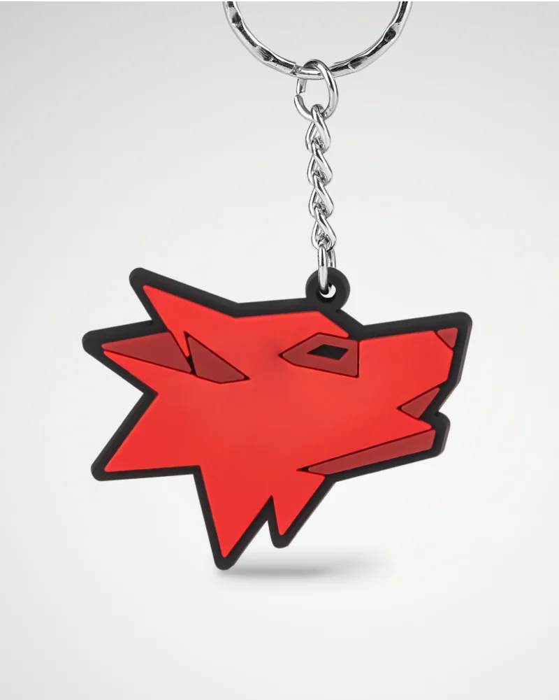 Red keychain featuring a wolf design, showcasing bold colors and detailed craftsmanship.