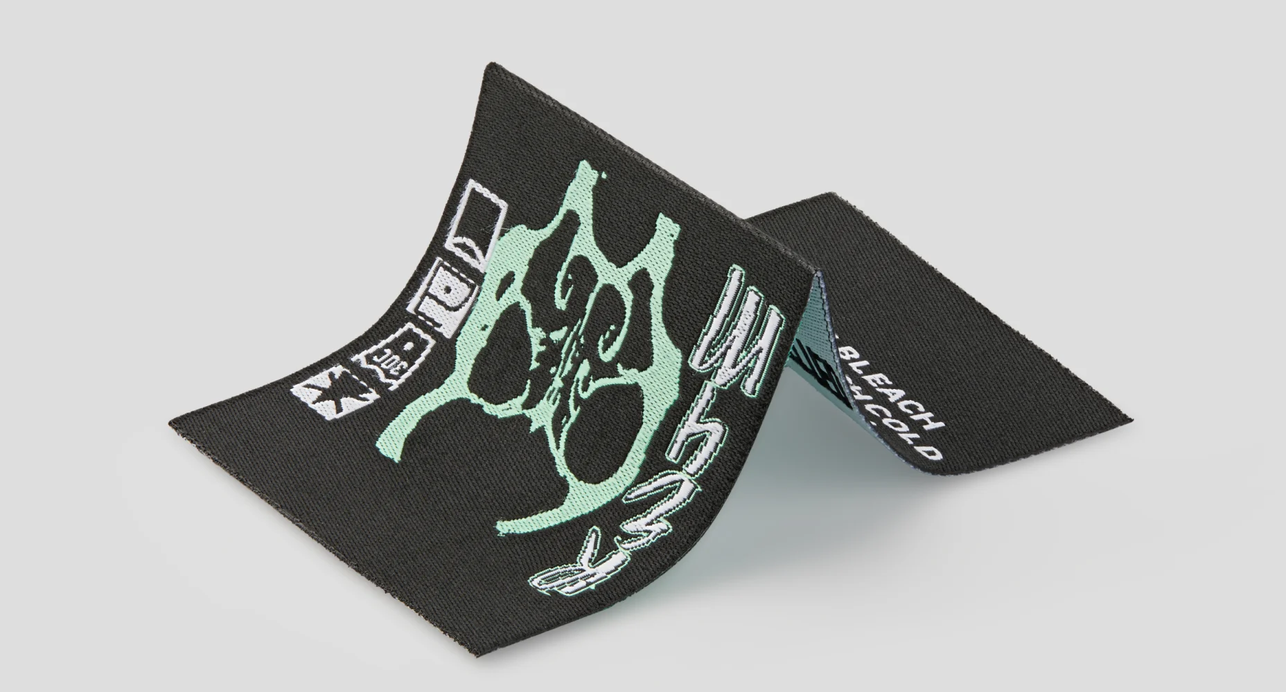 Custom woven label in an expanded form, showcasing intricate designs and detailed branding.