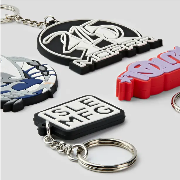 Personalized PVC keychains in various colors and designs, ideal for branding, gifts, or special events.