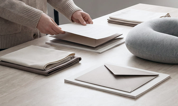 Fabric and material components prepared for neck pillow cut-and-sew assembly