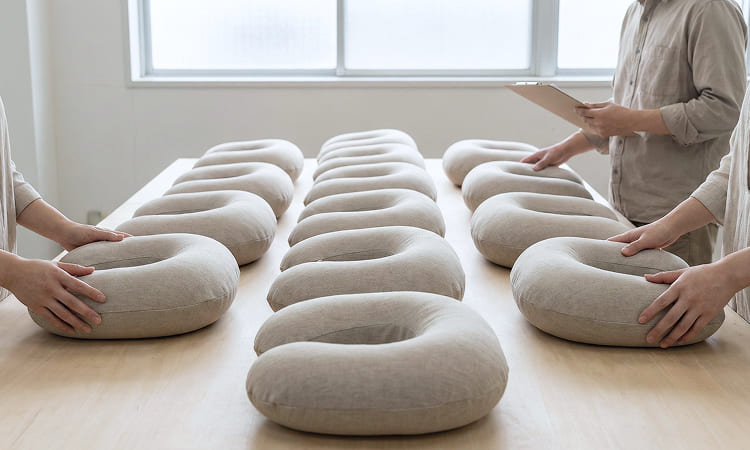 Batch of neck pillows arranged for quality inspection and manufacturing output validation