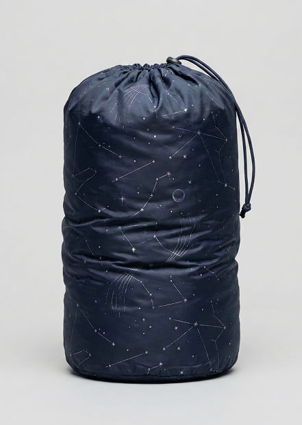 Travel neck pillow stored in compact drawstring pouch for portability and protection