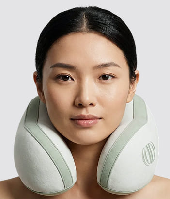 Structured memory foam neck pillow with smooth fabric cover and ergonomic contour support