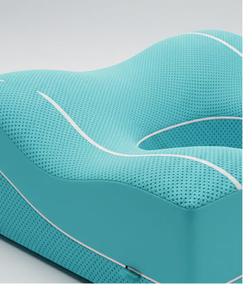 Ergonomic neck pillow with breathable fabric panels and precision contour shaping