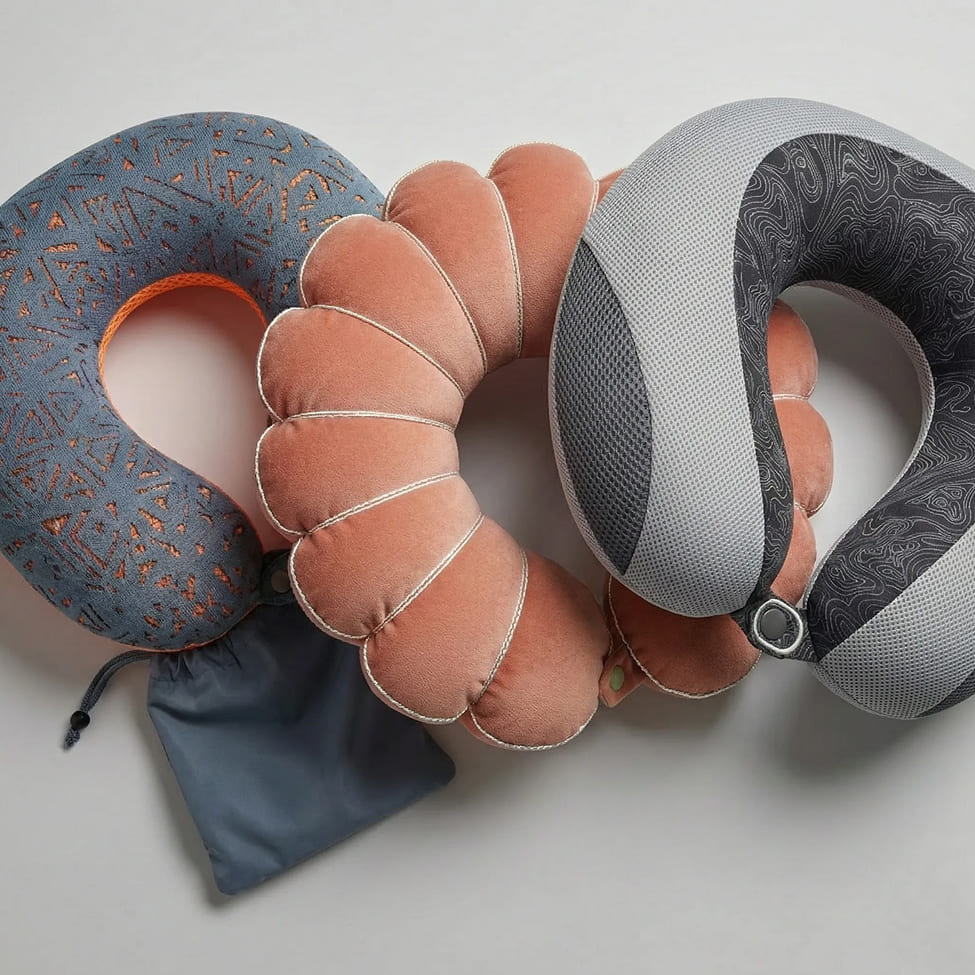 Multi-segment neck pillows showing flexible construction and removable fabric covers